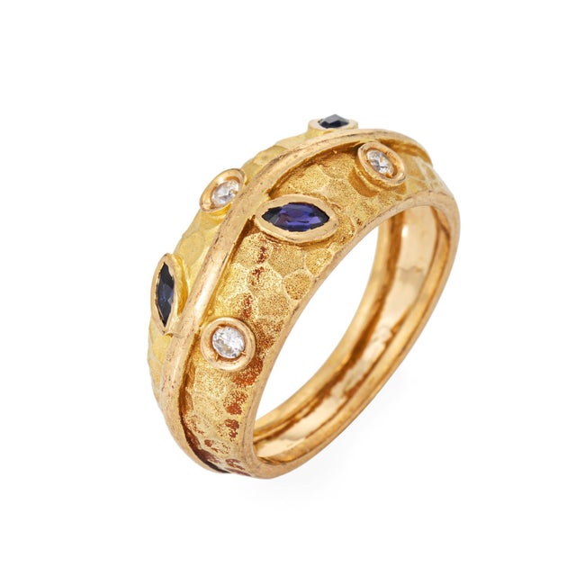 Stylish vintage leaf vine ring crafted in 19k yellow gold (circa 1980s). 3 marquise cut sapphires measure 3mm x 1.5mm....