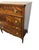 A John Widdicomb chest of drawers made in Grand Rapids, Michigan, around 1940. The case is veneered in bookmatched flame...