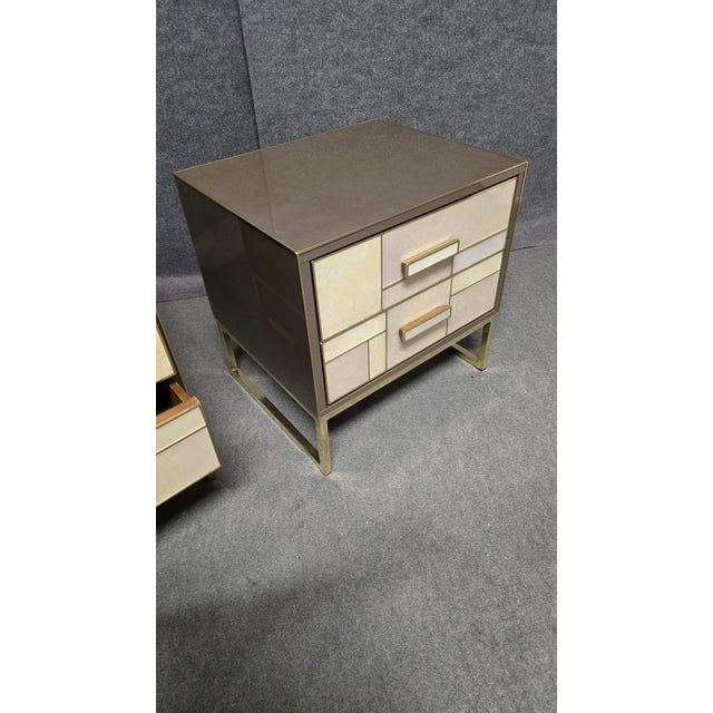 Bedside table handcrafted in Italy by Justfurnituress, with a walnut structure, stone-effect painted glass cladding and...
