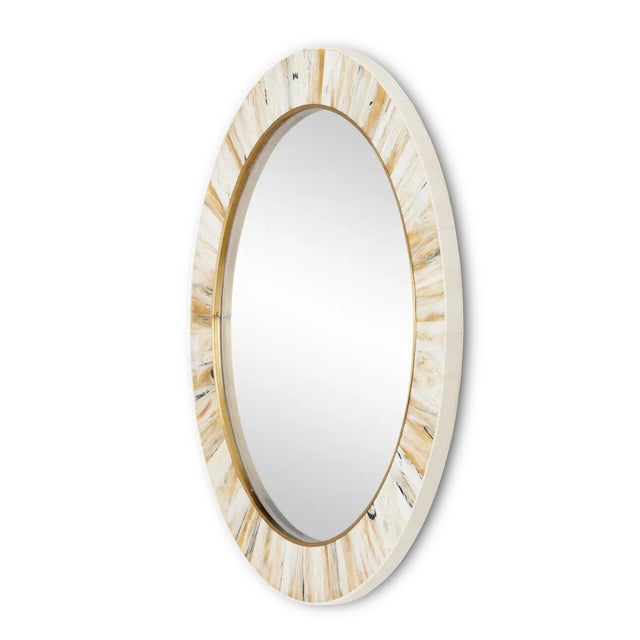The Niva Round Wall Mirror has the look of horn thanks to the talented artisans who work with composite to make it look...