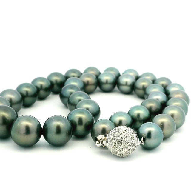 A timeless graduated Tahitian cultured black pearl necklace featuring 35 beautifully matched pearls measuring from 10.84...