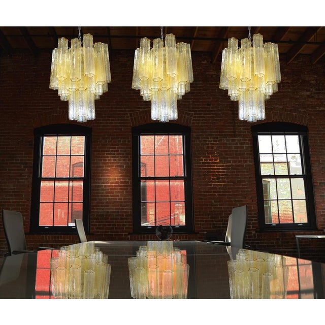 Trio Italian vintage chandeliers in Murano glass and nickel-plated metal structure. The armor polished nickel supports 30...
