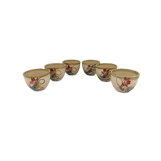 A beautiful Bat Trang Vietnamese ceramic tea service featuring a coordinated teapot, six tea cups, and a large square...