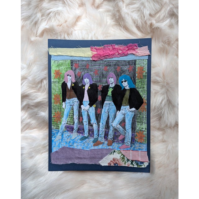 8.5" x 11" A mixed-media collage featuring the punk rock band The Ramones with blue, pink and purple hair, adorned in a...