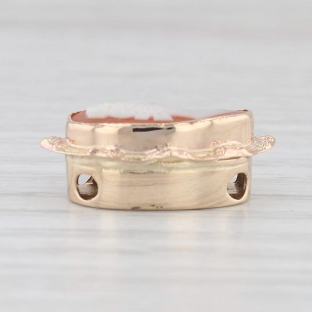 Gemstone Information: - Natural Shell - Size - 7.5 x 15 mm Cut - Oval - Carved Cameo Color - White and Orange Metal: 14k...