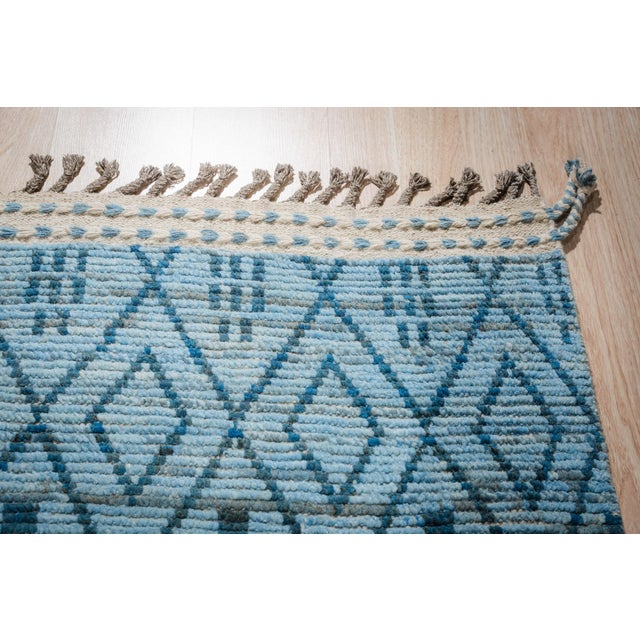 Stylish Marrakech Blue Hand-Knotted Wool Rug, Country of Origin: Pakistan. This striking piece offers a modern...
