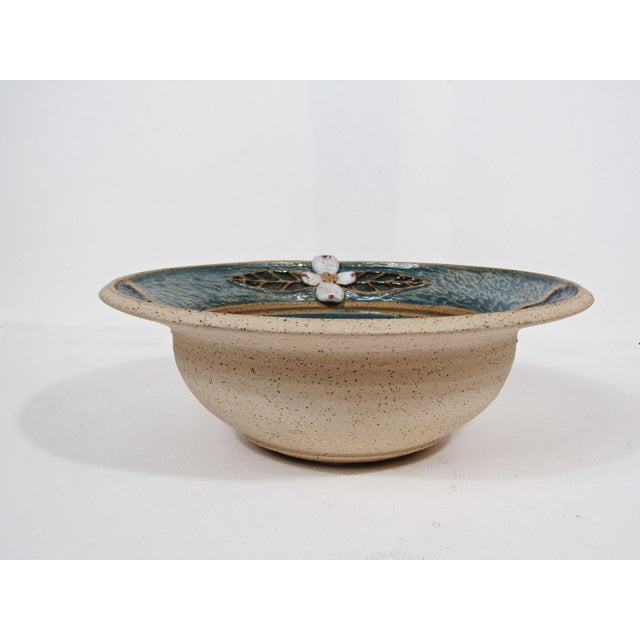 A beautifully balanced piece of Kentucky studio pottery signed “ML” for Mary White, featuring a softly textured blue-green...