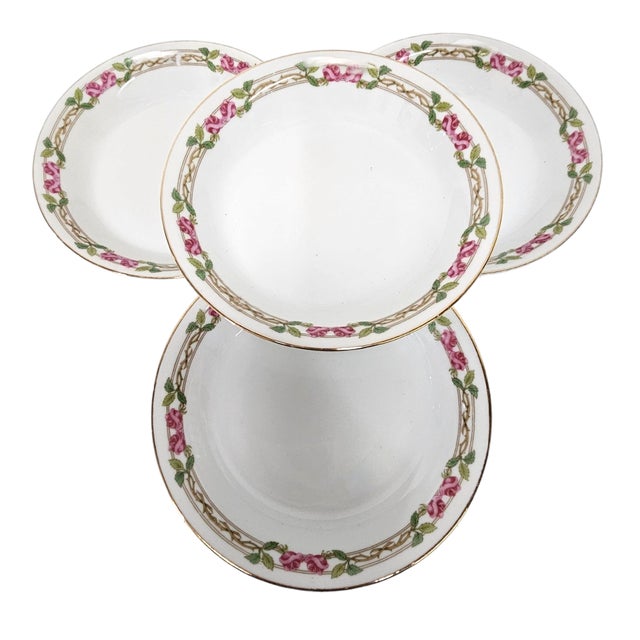 A refined set of four early 20th-century Limoges soup bowls by Guerin & Co, crafted in fine bone china and accented with...