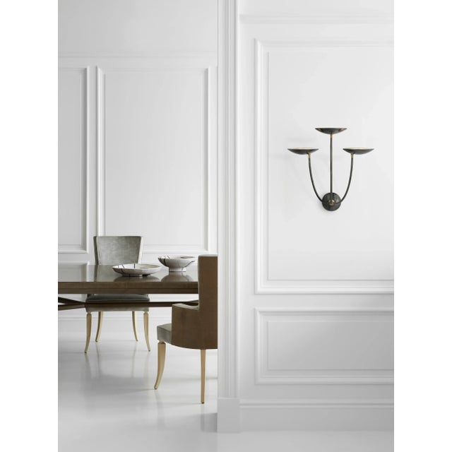 Keira Large Triple Sconce in Bronze and Hand-Rubbed Antique Brass Designer: Thomas O'Brien Height: 23" Extension: 13.25"...