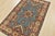 A tribal Caucasian Kazak rug hand-knotted with an all-wool pile on a cotton foundation. This oriental rug features a...