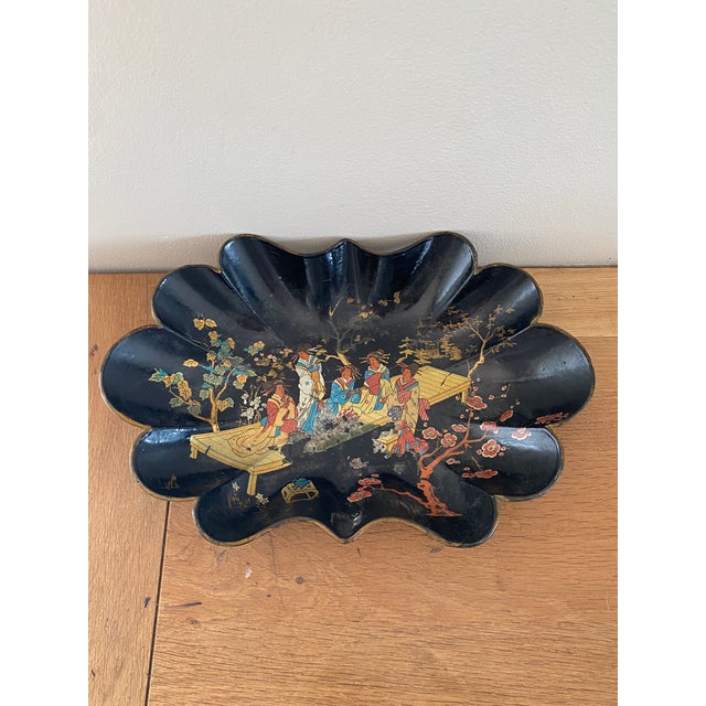 A beautiful papier-mâché tray with a Japanese-inspired design characteristic of Napoleon III productions, reflecting a...