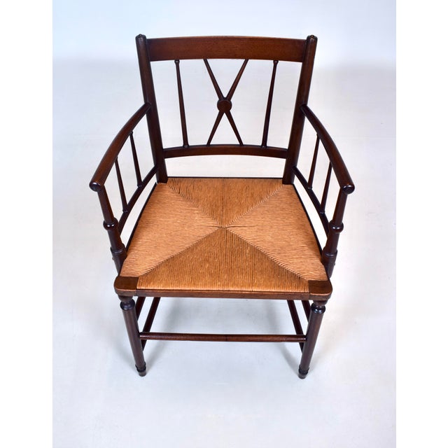 An antique Country Regency rush seat accent armchair with interesting and William Morris Arts & Crafts design influences....