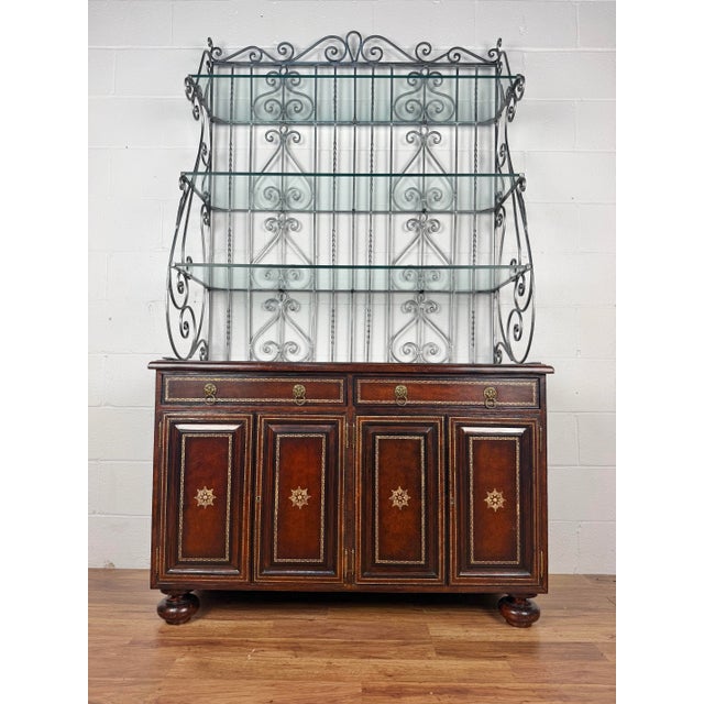 Maitland Smith Neoclassical Leather Wrapped Base Ornate Ironwork Baker’s Rack Dimensions: 81.25”h 46.25”w x 18.25”d Bottom...