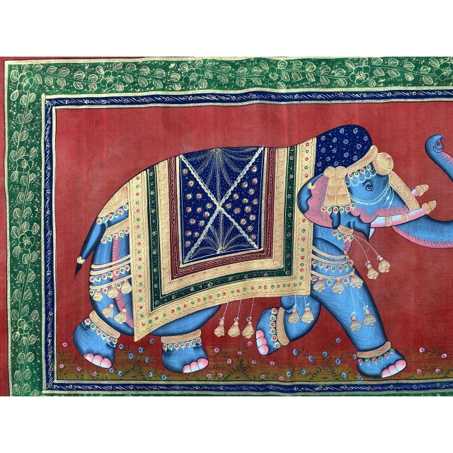 A royal elephant pigment painting on cloth from India's mughal period. This painting depicts a walking elephant on red...