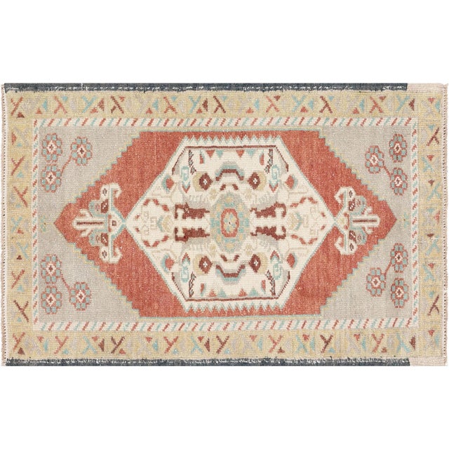 This Vintage Turkish Oushak Yastic is a 1'10" x 2'10" rug with a rich history and intricate design. Handmade from high-...