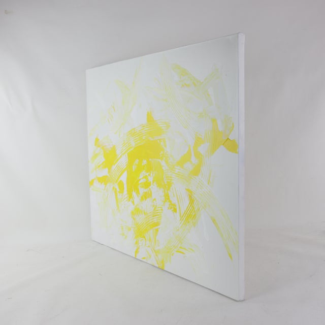 This vibrant modern art piece radiates energy and light through a dynamic exploration of bright lemon yellow and crisp...