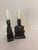 These antique bookends and candleholders are cast in a heavy metal with a dark patinaed finish. They are in the art deco...