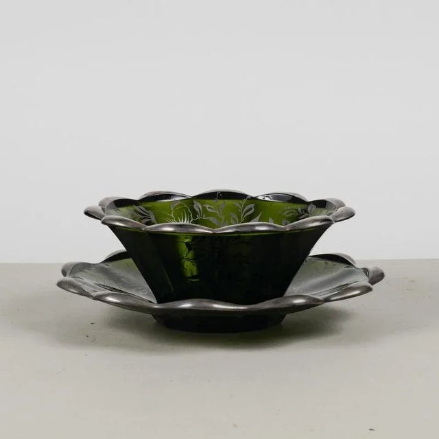 This exceptional set of two plates, one flat and one cup-shaped, is a true gem of vintage craftsmanship, perfect for...