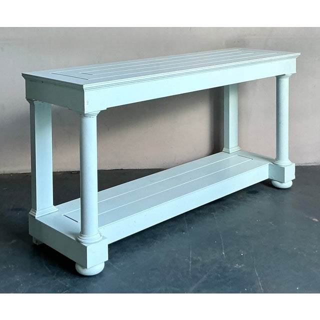 Discover the architectural elegance of the "Spotswood" console table by McKinnon and Harris, a paramount example of...