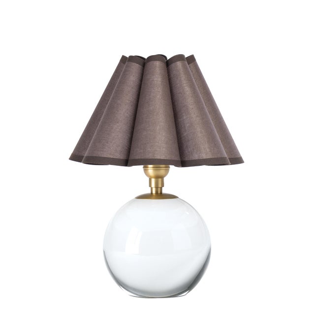 The Giorgio Mini Table Lamp provides a soft, inviting glow through its umber scalloped shade, making it a perfect accent...