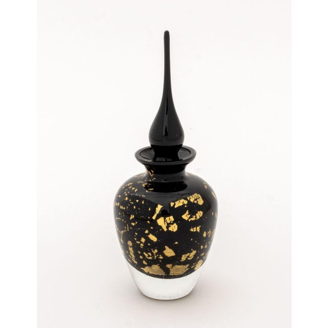 Group of Five Art Glass Perfume Bottles, comprising: one with etched orchid motif marked "S.I.N. 195. 85", one emerald...