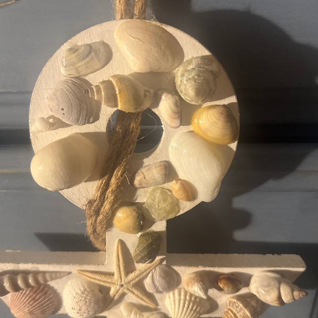A charming crafted coastal folk art wall hanging sculpted in the form of a classic ship's anchor. This whimsical piece...