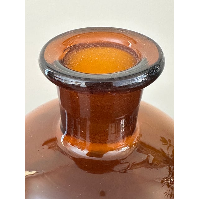 Authentic 1930s German dark amber glass apothecary bottle with original labeling. The front reads: Thymusyl These bottles...