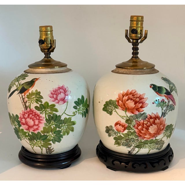 Pretty pair of chinoiserie style handpainted ginger jar lamps with white linen drum shade. Not precisely the same if you...