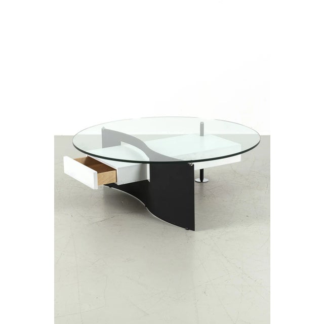 Nice abstract shaped coffee table by Caspirini Klee. The table has 1 handy drawer. Has some traces of use such as some...