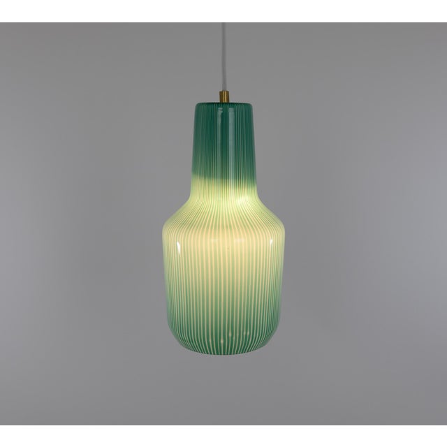 Green Murano glass pendant designed by Massimo Vignelli at the start of his impressive career in design and produced by...