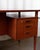 A refined Danish Modern writing desk by HP Hansen, produced in the 1960s during the height of Scandinavian furniture...