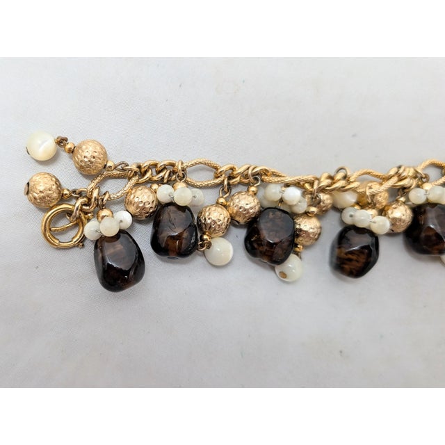 Vintage 1960s Signed Napier Goldtone Faux-Topaz & Mother of Pearl Charm Bracelet For Sale - Image 10 of 14