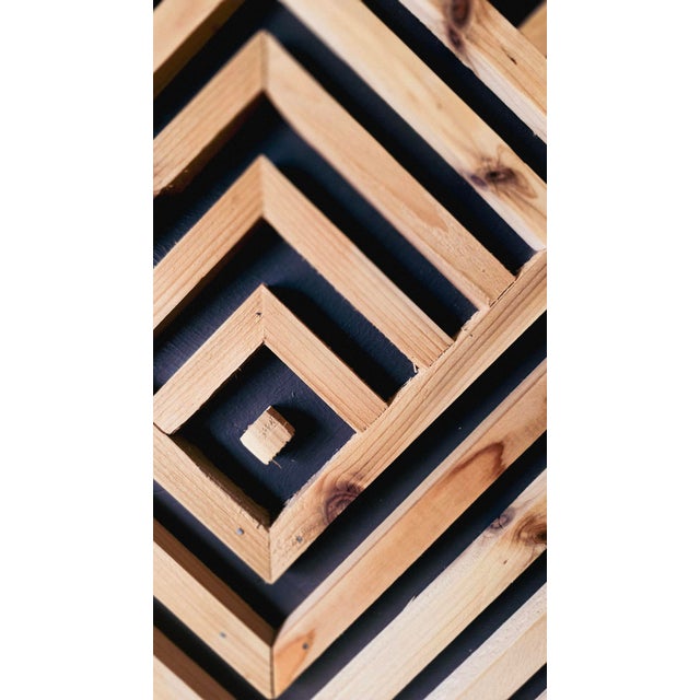 This striking, oversized piece of wall art was crafted from authentic reclaimed wood salvaged from a 1920s fireplace...