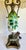 Here is a charming, antique Victorian Revival table lamp featuring a hand-painted floral glass body, ornate cast metal...