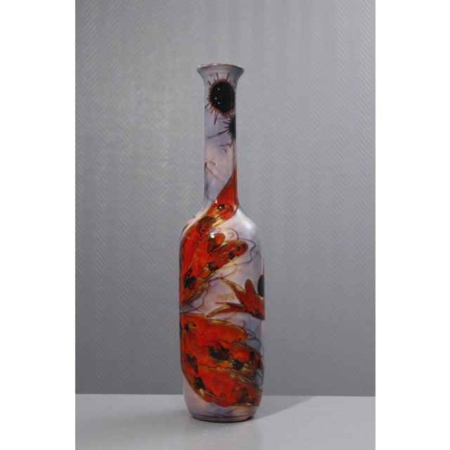 Impressive bottle-shaped lamp base by Kurt & Monique Brunner, workshop in Vallauris circa 1960. Swirling fish decoration...