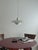 When lit, the light bounces between the three nested shades before spilling softly into the room, a warm, diffused glow...