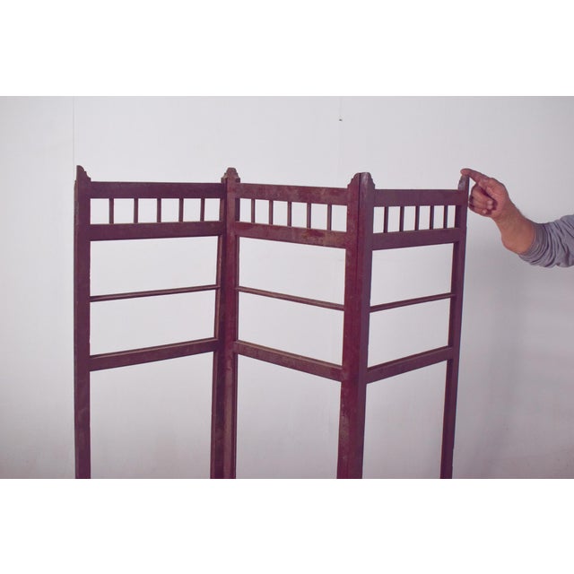 This Portuguese wooden folding screen, presented without fabric lining, highlights the craftsmanship and structural beauty...