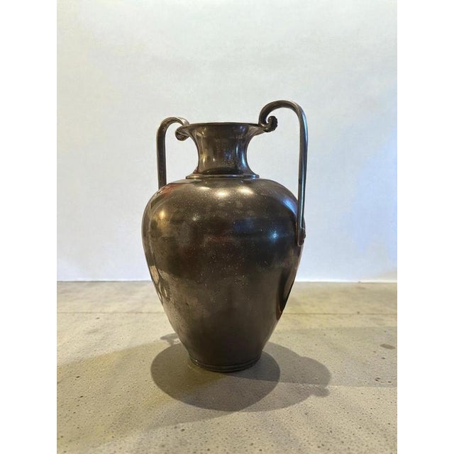 An elegant and highly collectible swedish art deco pewter vase, designed by sylvia stave and produced by cg hallberg,...