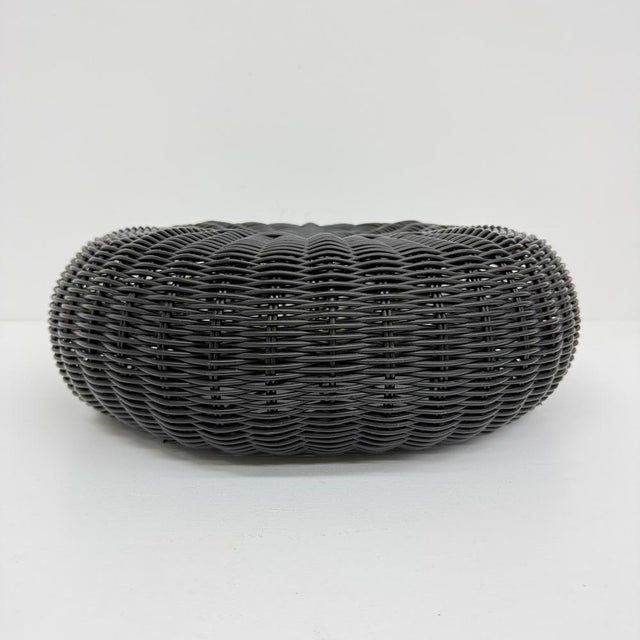 Vintage Round Black Woven Plastic Ottoman from Ikea, 1980s, in Good conditions. Designed 1980 to 1989 This piece has an...