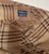 Woven in Scotland for Ralph Lauren, this beautiful neutral colored wool plaid throw with its hand-twisted 3” fringe can...