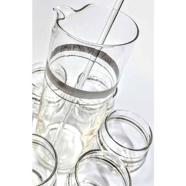 This is a dream set - a mid-century modern collector's dream. Dorothy Thorpe style cocktail set with a twist of tomorrow....