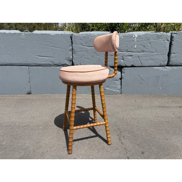 Stunning Barstools, faux bamboo wood and fabric seat and back. Stools swivel with return. Commercial grade quality. Wood...