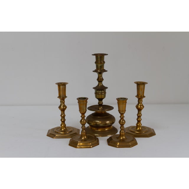 Antique Danish Brass Candlesticks. Set of 5. Set of five candle holders in solid brass from Denmark circa 1900-1910. This...
