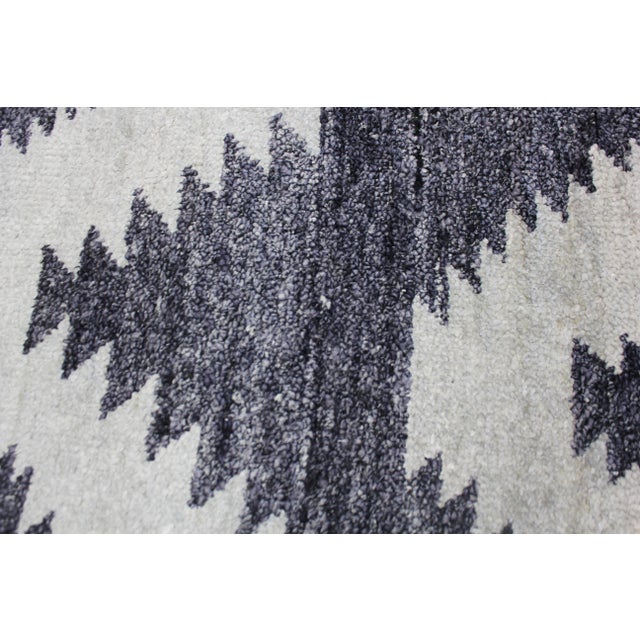 A beautiful handmade Bamboo silk rug. The geometric design woven in by Aara Rug hands. This rug is made of 75% bamboo silk...
