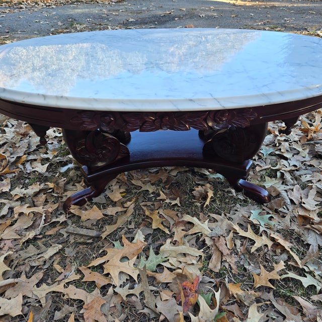 This mahogany table exudes elegance. The base features a dark stained wood with rose embellishments to complement the...