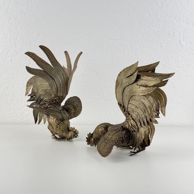 A beautifully detailed pair of mid-century brass roosters, captured in a lively foraging pose. Each sculpture is finely...