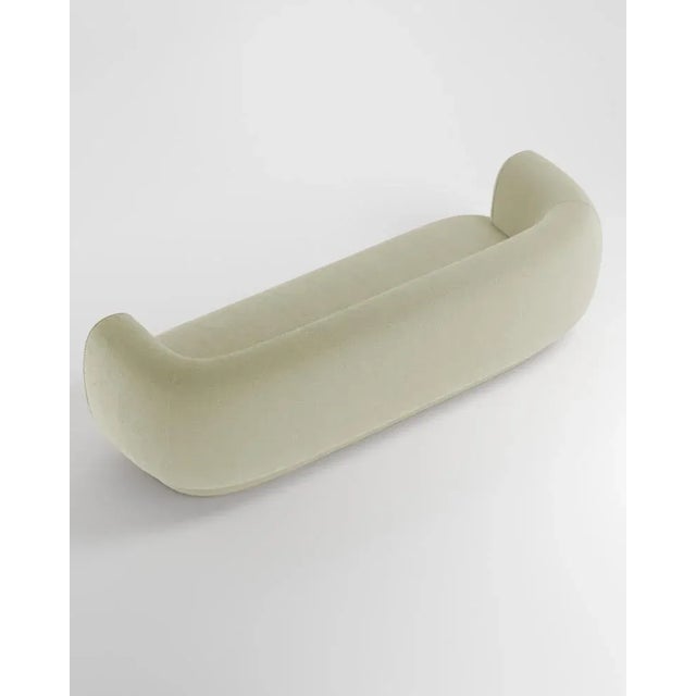 Hug sofa is defined by clean, simple lines and a distinctive armrest detail. The armrest, half overlapping the seat...