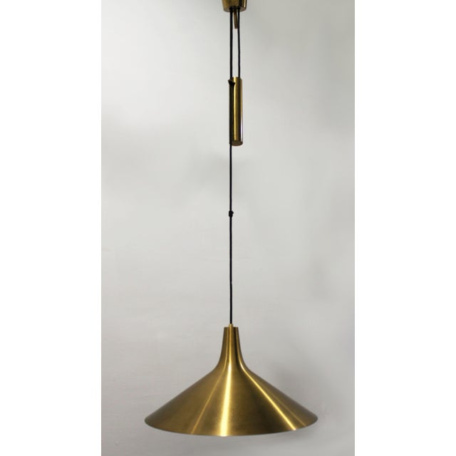 An elegant Danish counterweight pendant light, the "Fujiyama" model, produced in Copenhagen by Th. Valentiner in the...
