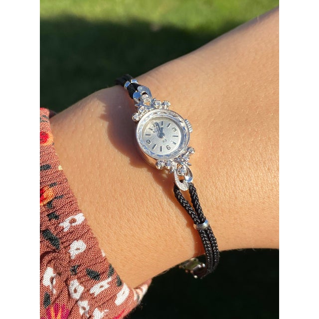 Ladies 14K White Gold Bulova Watch set with Diamonds. Complete with original box and papers, give this Bulova watch to...