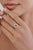This Statement halo ring features 1.15 ct natural pear-cut emerald, set in 14K white gold. The emerald measures 7.5 × 6 mm...